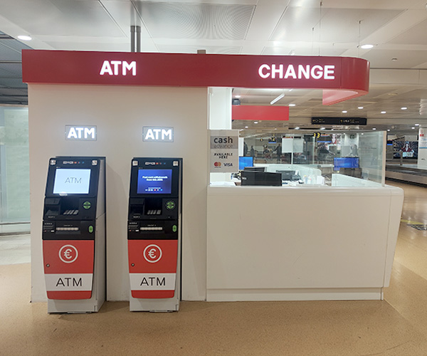 yex Change Agency in the airside arrivals area of Venice Airport, with currency exchange desk and ATM for withdrawals in various currencies