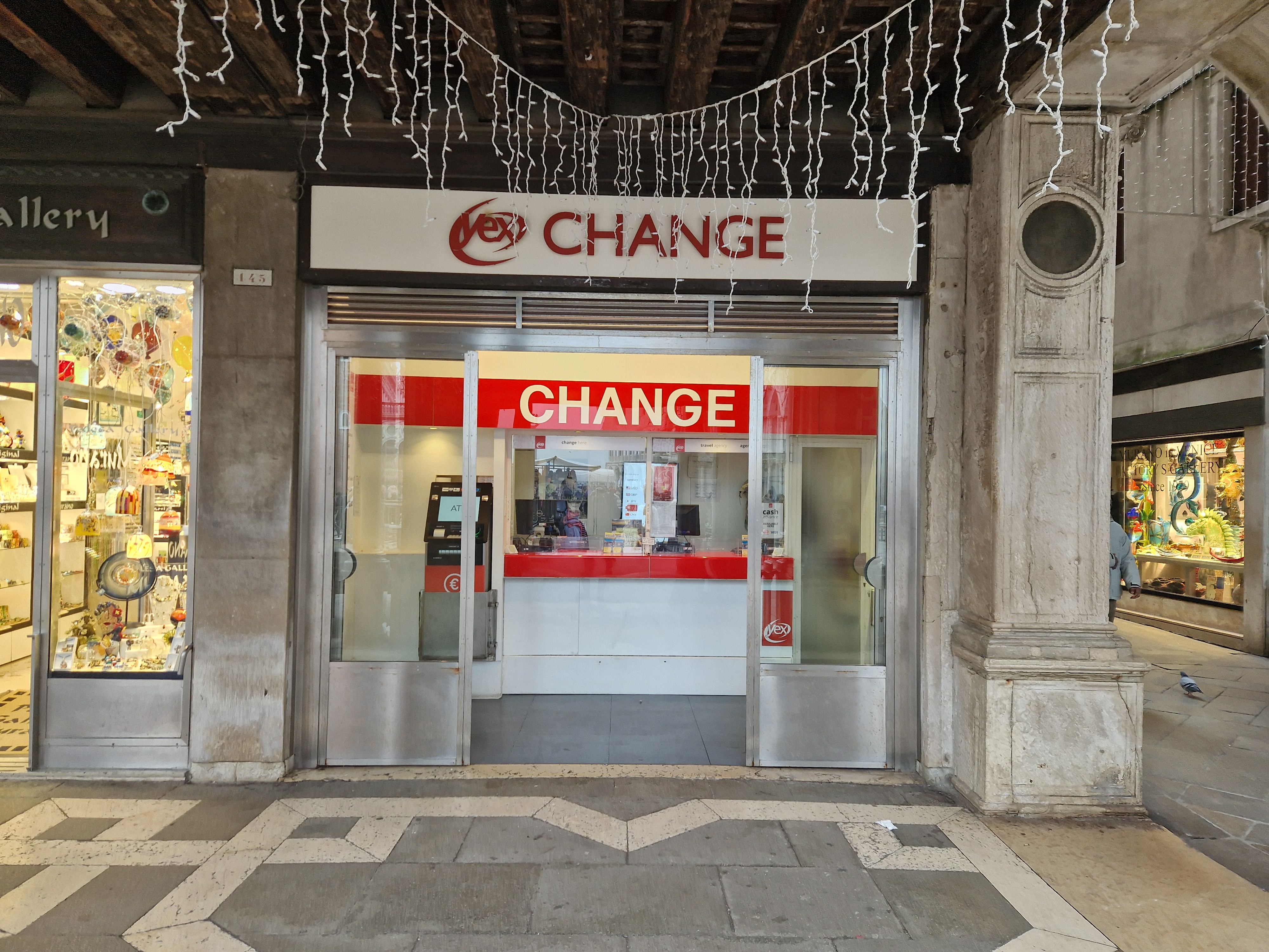 View of the front office of the Yex Change agency under the arcades of Piazza San Marco in Venice