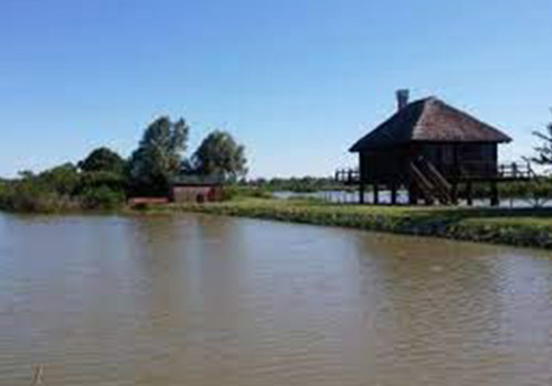 Image showing a canal with a small hut nearby