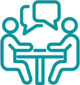 Icon of two people sitting at a table with a cartoon above them, symbol of dialogue, communication and collaboration