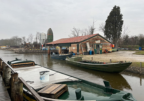 Image showing a small harbor with boats on a lake.