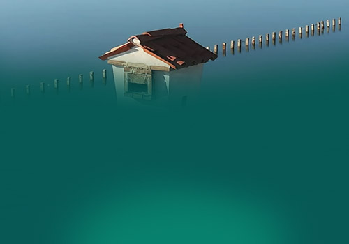 Image showing a house reflected softly in a lake.